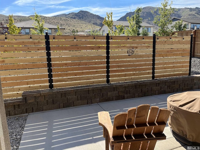 exterior space featuring fence and a mountain view