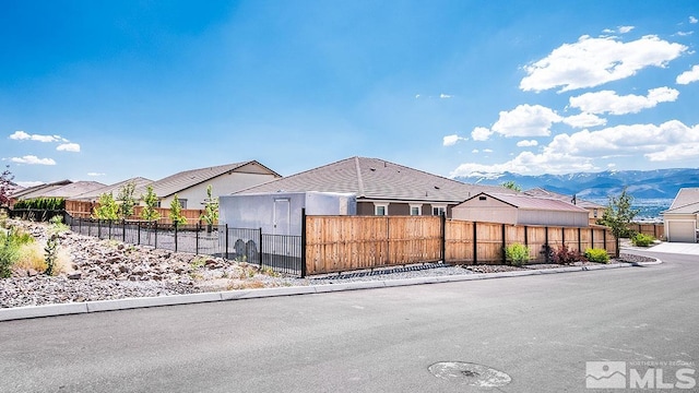 view of front of home featuring a fenced front yard and a residential view