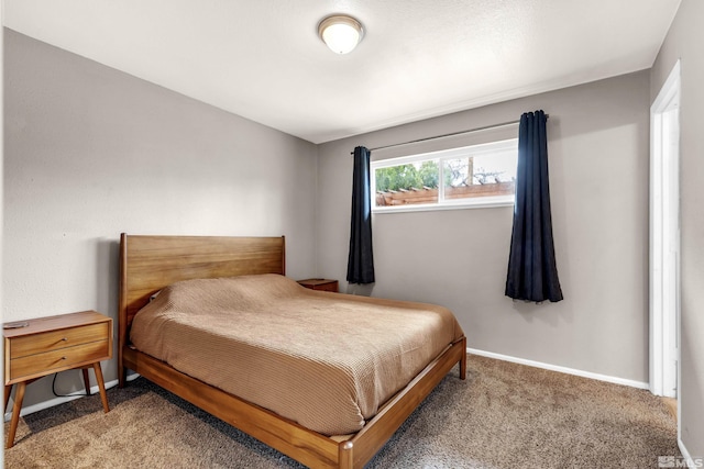 carpeted bedroom with baseboards