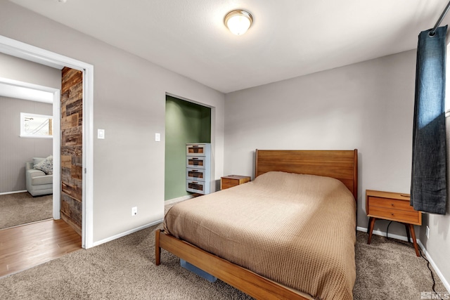 carpeted bedroom with baseboards