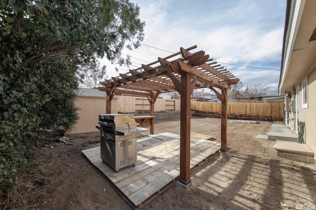 view of patio / terrace with a fenced backyard, grilling area, and a pergola