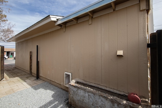 view of side of property with a patio