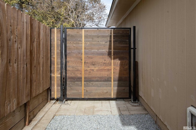 view of gate featuring fence