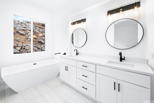 full bathroom featuring tile patterned flooring, a soaking tub, a sink, and double vanity