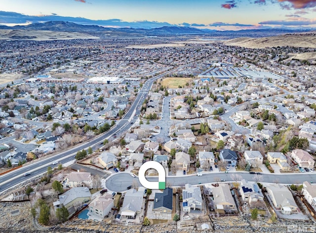 drone / aerial view with a residential view and a mountain view