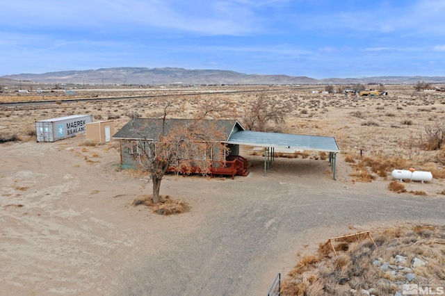 exterior space featuring a rural view and a desert view