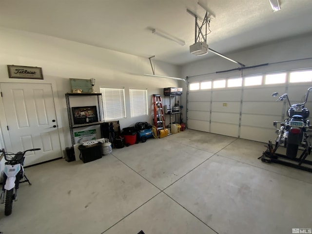 garage featuring a garage door opener