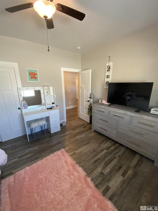 bedroom featuring a ceiling fan and dark wood finished floors