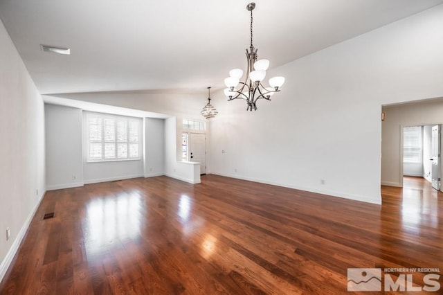 unfurnished room with lofted ceiling, a chandelier, visible vents, baseboards, and dark wood-style floors