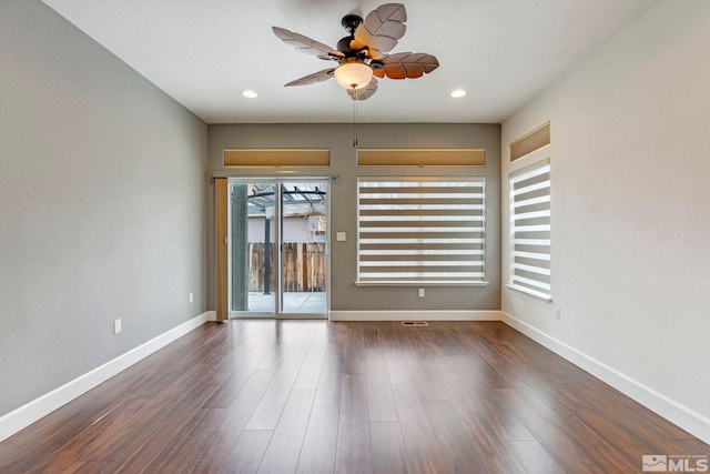 spare room featuring ceiling fan, baseboards, dark wood-style flooring, and recessed lighting