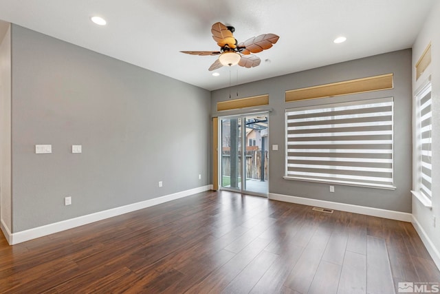 unfurnished room featuring ceiling fan, recessed lighting, wood finished floors, visible vents, and baseboards