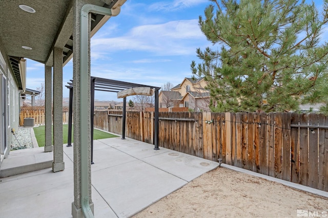 view of patio / terrace with fence private yard, central AC, and a pergola