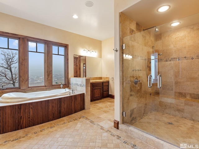 bathroom featuring a stall shower, a garden tub, vanity, and recessed lighting