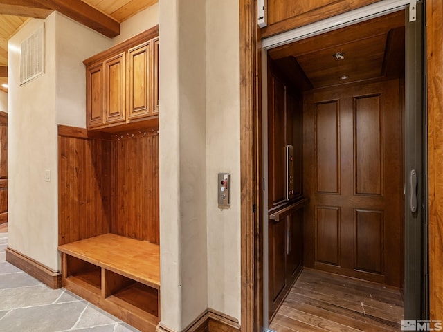 mudroom featuring visible vents, baseboards, wood ceiling, beam ceiling, and elevator