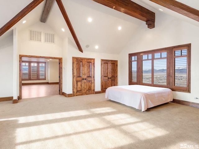 unfurnished bedroom with high vaulted ceiling, beam ceiling, visible vents, and carpet flooring