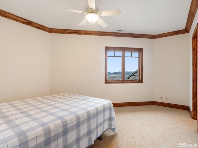 bedroom featuring light carpet, baseboards, visible vents, and crown molding