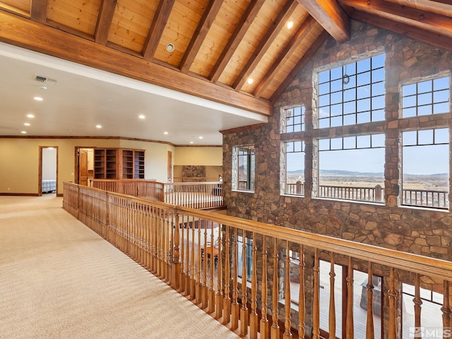 hallway featuring carpet, visible vents, high vaulted ceiling, wooden ceiling, and beamed ceiling