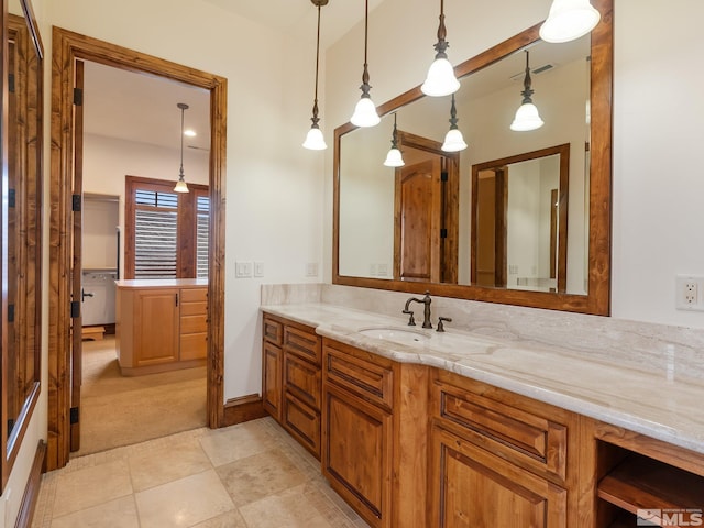 bathroom with tile patterned flooring, visible vents, and vanity