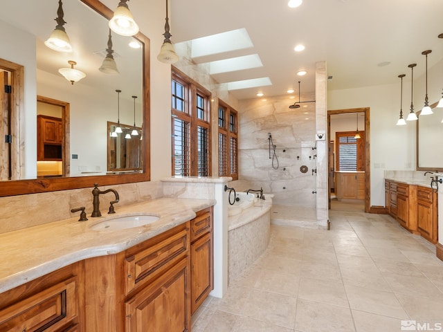 bathroom with two vanities, a sink, a bath, a walk in shower, and tile patterned floors