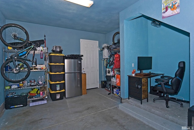 garage featuring freestanding refrigerator