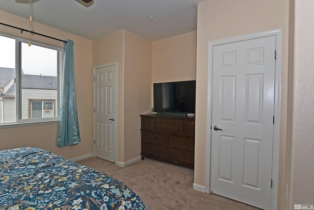carpeted bedroom with baseboards