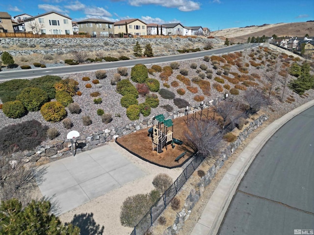 birds eye view of property with a residential view
