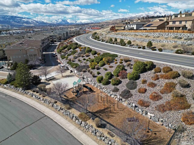 birds eye view of property featuring a mountain view