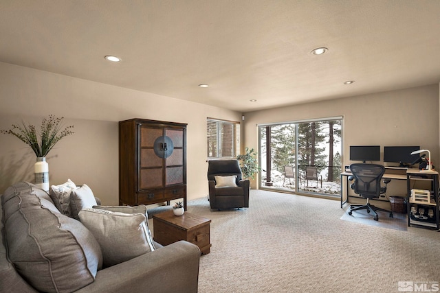 living area featuring carpet and recessed lighting