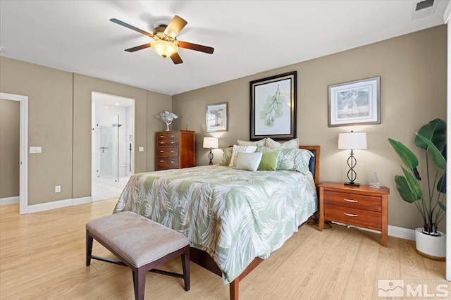 bedroom featuring ceiling fan, connected bathroom, light wood-style flooring, visible vents, and baseboards