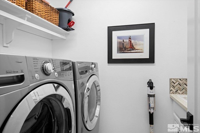 laundry room featuring laundry area and washing machine and dryer