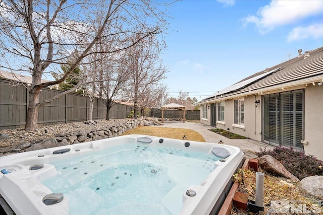 view of pool with a patio area, a fenced backyard, and a hot tub