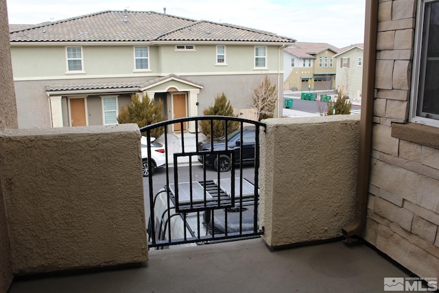 view of gate with a residential view
