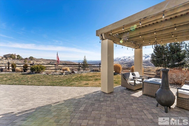 view of patio / terrace featuring a mountain view