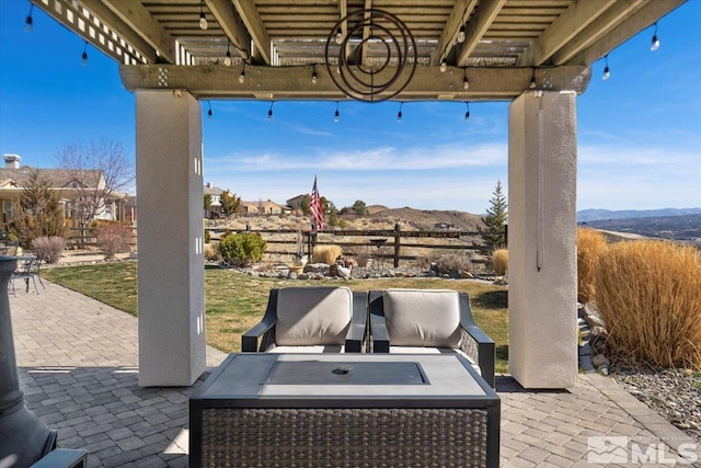 view of patio with an outdoor hangout area and a mountain view