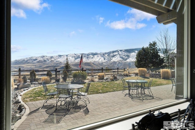 exterior space featuring outdoor dining area and a mountain view