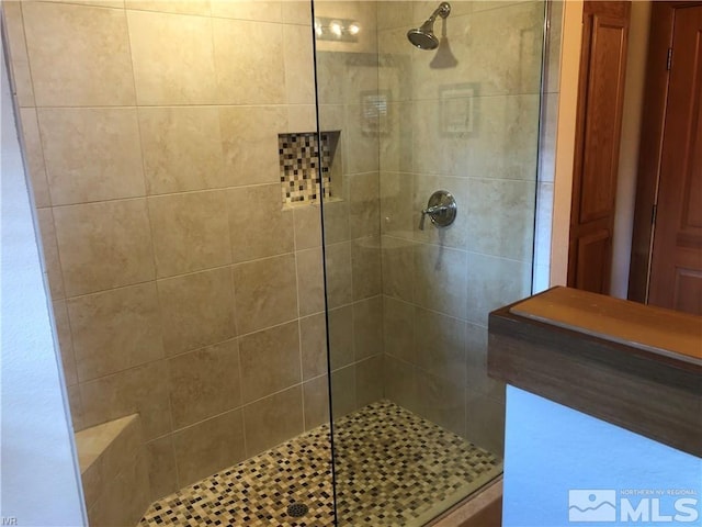 full bathroom with tiled shower