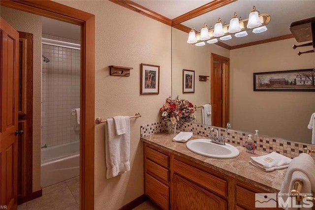 bathroom with tile patterned flooring, ornamental molding, backsplash, and vanity