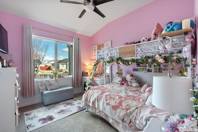 carpeted bedroom featuring lofted ceiling and a ceiling fan