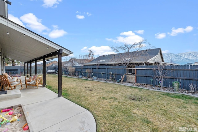 view of yard featuring a patio area and a fenced backyard