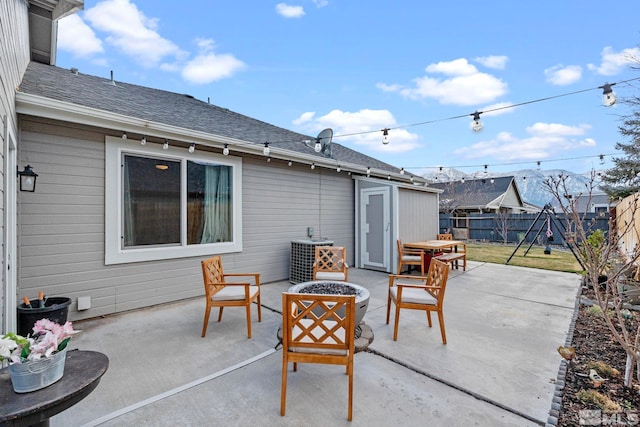 view of patio / terrace with fence and a fire pit