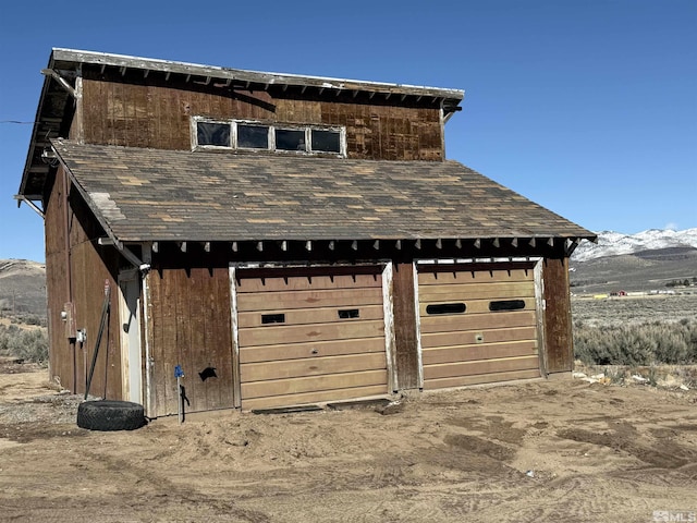 detached garage with a mountain view