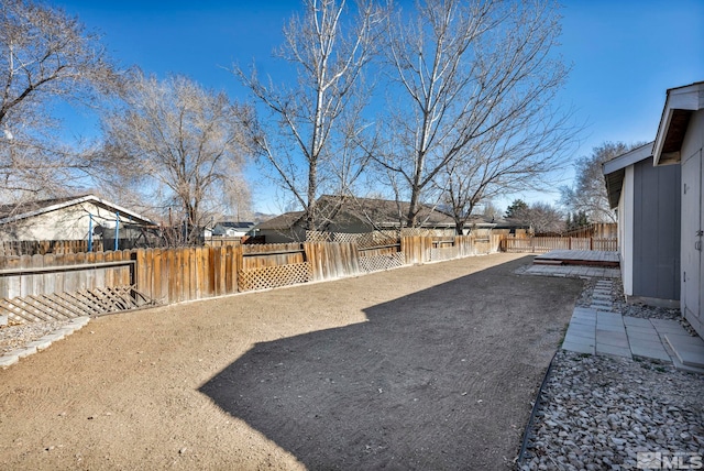 view of yard featuring a patio area and a fenced backyard