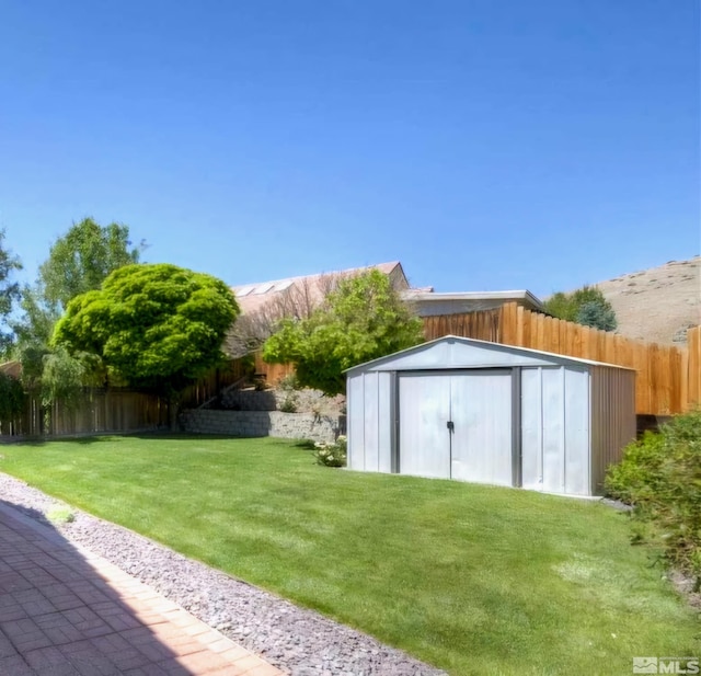 view of shed with a fenced backyard