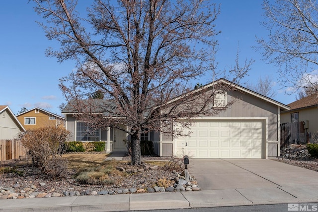 ranch-style home featuring concrete driveway, fence, and a garage