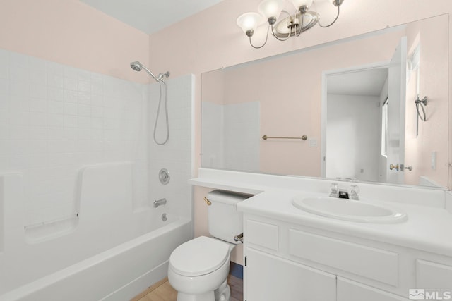 bathroom featuring a chandelier, toilet, vanity, and bathtub / shower combination