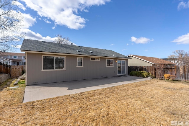 back of property with a patio, a fenced backyard, a lawn, and crawl space