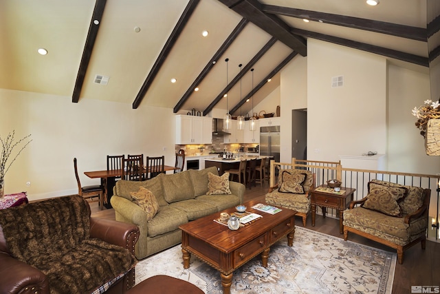 living area featuring high vaulted ceiling, light wood-style flooring, visible vents, and beam ceiling