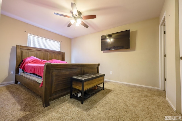 carpeted bedroom featuring ceiling fan and baseboards