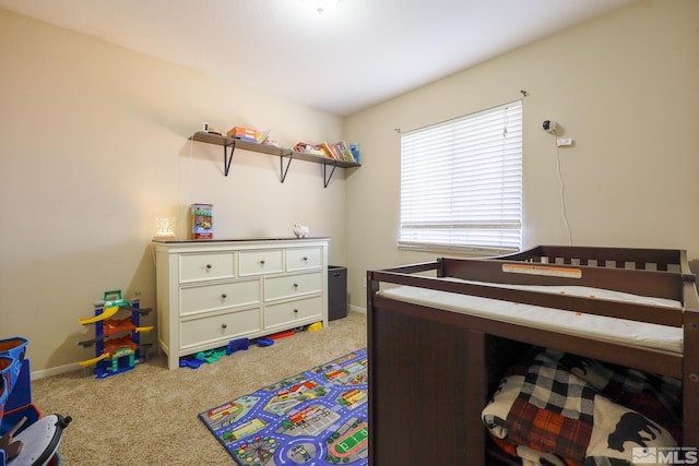 bedroom featuring carpet flooring and baseboards