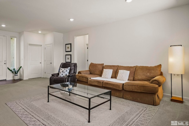 living room featuring recessed lighting, carpet flooring, and baseboards